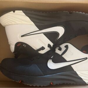 Nike Women Black and White Turf shoes.